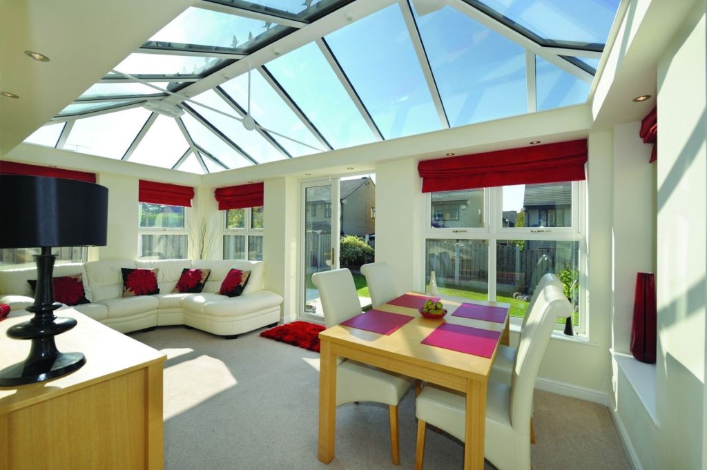 inside view of glass roof conservatory with french doors